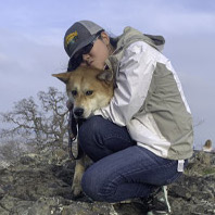 Sasha Mayton, Receptionist Hugging Dog